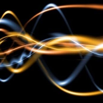 Abstract gold and blue energy waves representing SCENAR electrical signals.