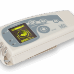 White COSMODIC EX715Ag therapy device with silver electrodes and yellow digital display.