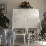 Dr. Yuri Gorfinkel next to a whiteboard during a 1998 SCENAR seminar in the Bahamas.