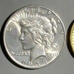 Three vintage coins made of copper, silver, and gold, arranged horizontally.
