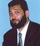 Dr. Yuri Gorfinkel, co-developer of SKENAR technology, in a suit and tie.