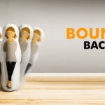 Inflatable roly-poly toy with a woman illustration swaying, labeled "BOUNCE BACK".