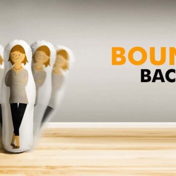 Inflatable roly-poly toy with a woman illustration swaying, labeled "BOUNCE BACK".